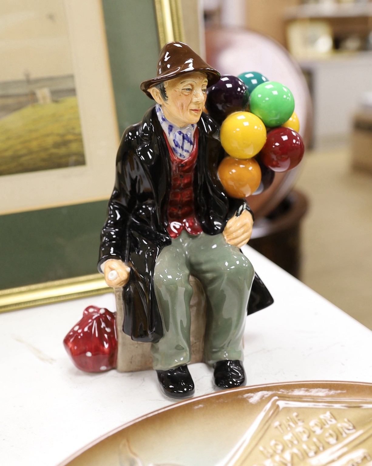 Seven Royal Doulton balloon seller figures in various sizes, a similar teapot and a dish (9), tallest Biddy Penny Farthing, 22cms high